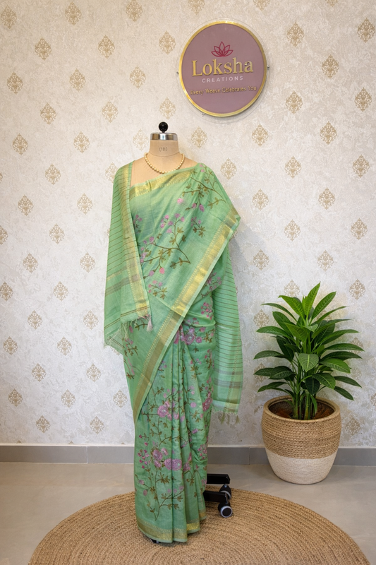 Mint Green Linen Saree with Floral Machine Embroidery & Zari Border